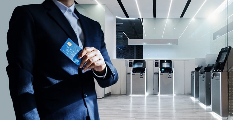 bank-manager-holding-credit-card